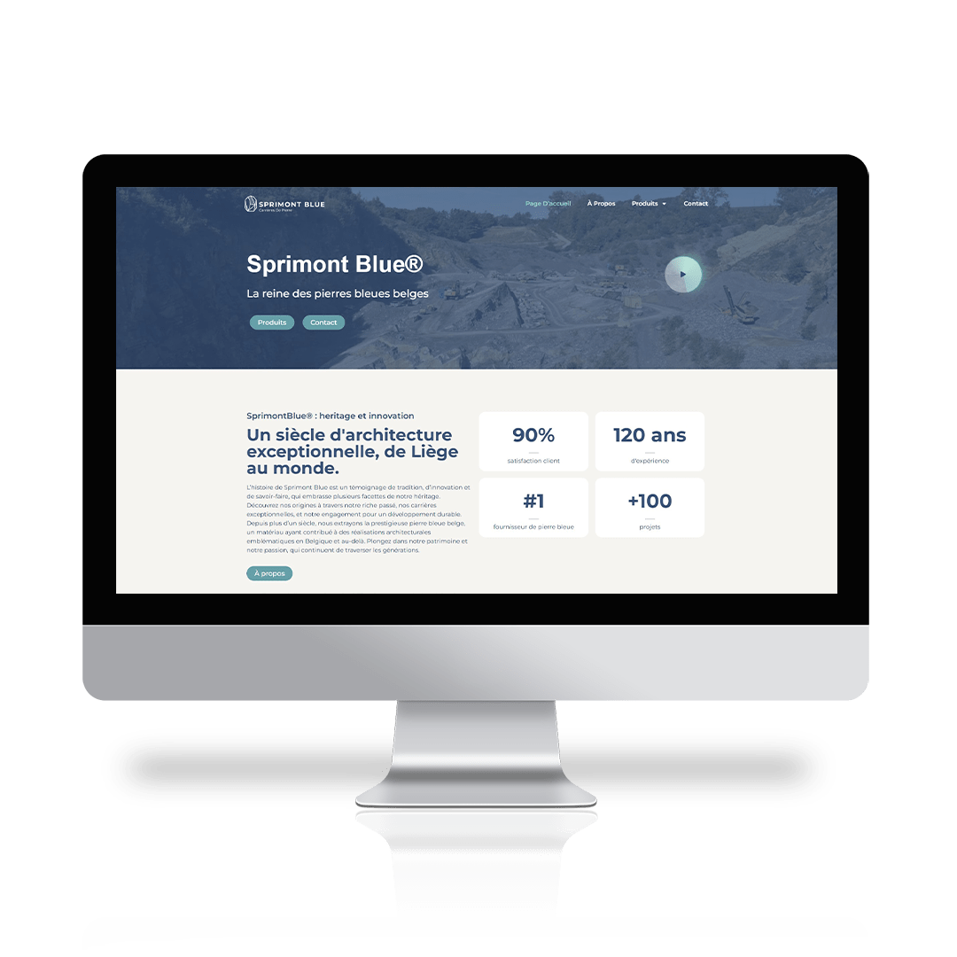 Een computerscherm toont de homepage van Sprimont Blue®, met tekst over Belgisch blauwsteen, boeiende statistieken en een bergachtergrond - een voorbeeld van elegant webdesign op een moderne microsite.